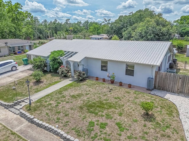 3892 Belmar Pl, Chipley, FL 32428 - single story home with stucco siding, metal roof, and central air condition unit