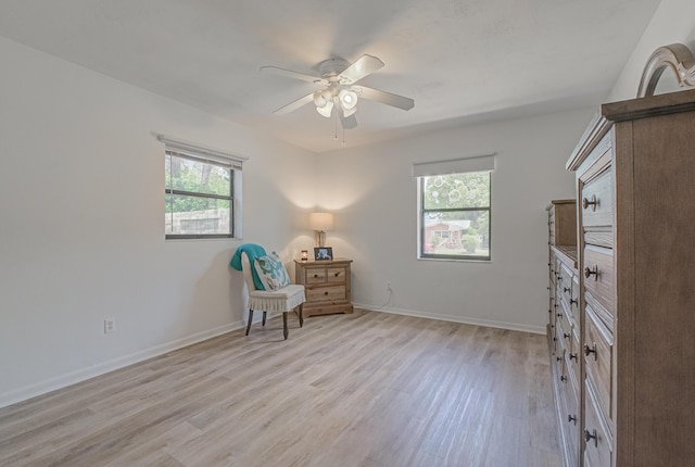 3892 Belmar Pl, Chipley, FL 32428 - sitting room featuring light wood finished floors, a ceiling fan, and baseboards