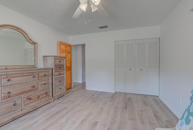 3892 Belmar Pl, Chipley, FL 32428 - unfurnished bedroom featuring light wood-type flooring, a closet, ceiling fan, and baseboards