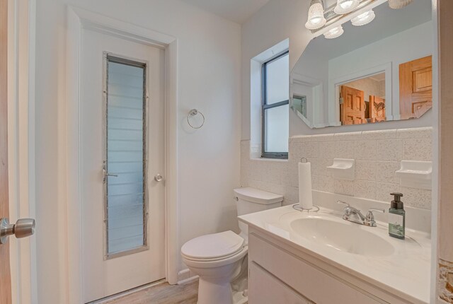 3892 Belmar Pl, Chipley, FL 32428 - bathroom with vanity, toilet, and wood finished floors