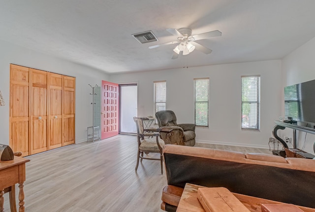 3892 Belmar Pl, Chipley, FL 32428 - living area with ceiling fan, light wood finished floors, and baseboards