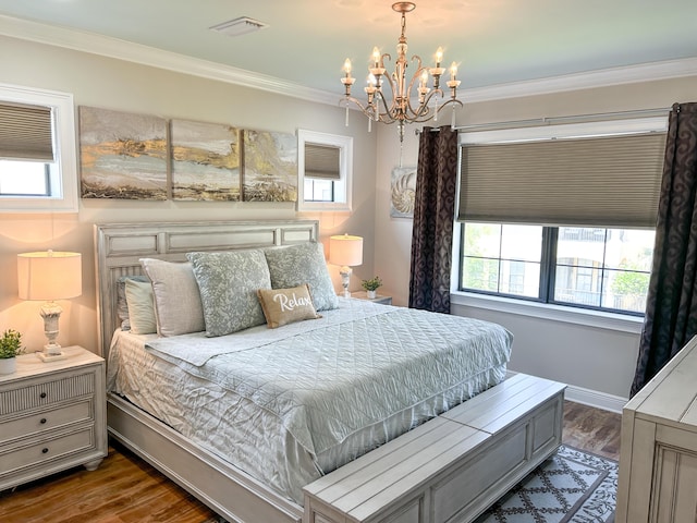 1976 Baytowne Loop, Miramar Beach, FL 32550 - bedroom with a chandelier, wood finished floors, and crown molding