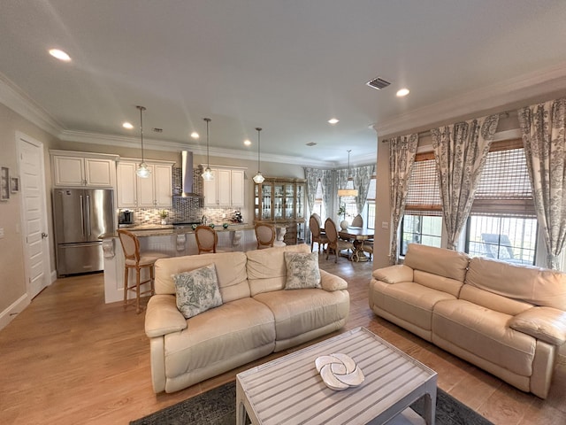 1976 Baytowne Loop, Miramar Beach, FL 32550 - living area with light wood finished floors, recessed lighting, and crown molding