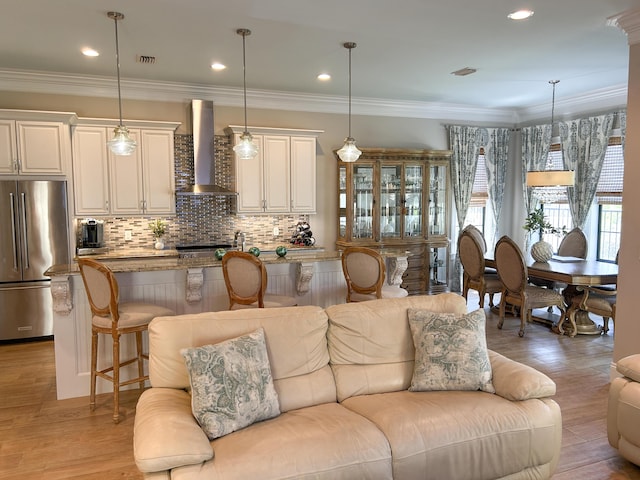 1976 Baytowne Loop, Miramar Beach, FL 32550 - living area with recessed lighting, light wood-style floors, and ornamental molding