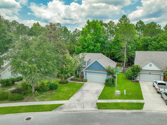 53 Concert Ct, Freeport, FL 32439 - view of front facade featuring driveway and a front yard