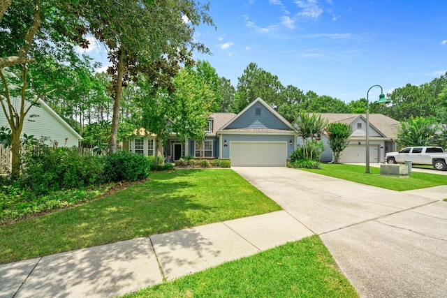 53 Concert Ct, Freeport, FL 32439 - view of front facade with a garage, driveway, and a front lawn