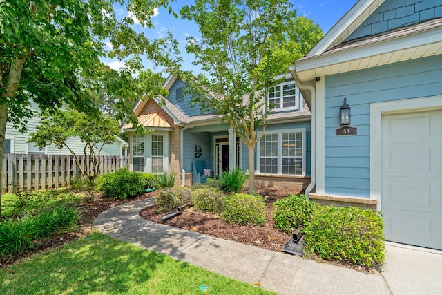 53 Concert Ct, Freeport, FL 32439 - doorway to property with roof with shingles and brick siding