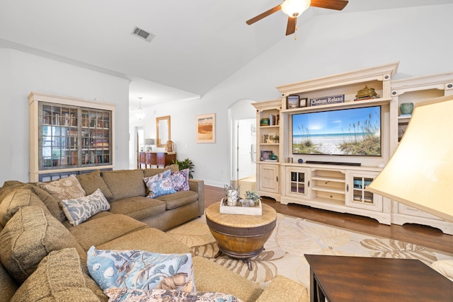 53 Concert Ct, Freeport, FL 32439 - living room with wood finished floors, ceiling fan, arched walkways, and high vaulted ceiling