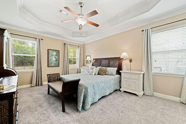 53 Concert Ct, Freeport, FL 32439 - bedroom featuring a tray ceiling, ornamental molding, light colored carpet, baseboards, and ceiling fan