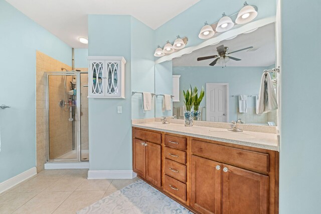 53 Concert Ct, Freeport, FL 32439 - full bathroom featuring double vanity, a stall shower, a ceiling fan, tile patterned flooring, and baseboards