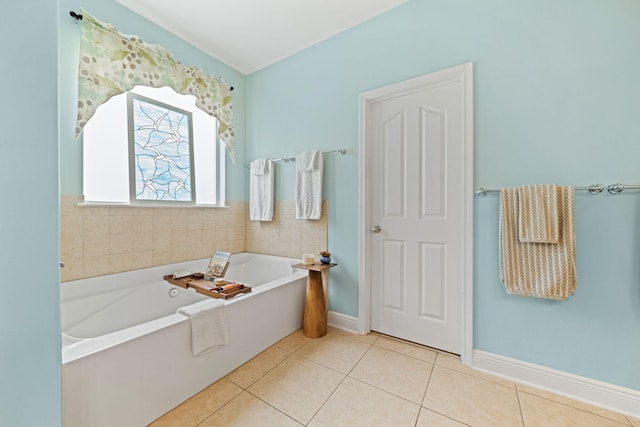 53 Concert Ct, Freeport, FL 32439 - full bath featuring a garden tub, tile patterned flooring, and baseboards