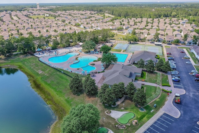 53 Concert Ct, Freeport, FL 32439 - aerial view of property's location with a pool area, a nearby body of water, and nearby suburban area