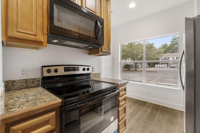 15284 331 Business Unit 11B, Freeport, FL 32439 - kitchen featuring black appliances, wood finished floors, recessed lighting, and baseboards