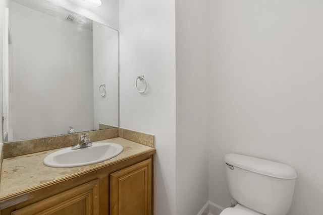 15284 331 Business Unit 11B, Freeport, FL 32439 - bathroom with toilet, vanity, and baseboards