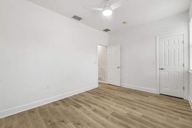 15284 331 Business Unit 11B, Freeport, FL 32439 - unfurnished bedroom featuring light wood-style flooring, baseboards, and a ceiling fan