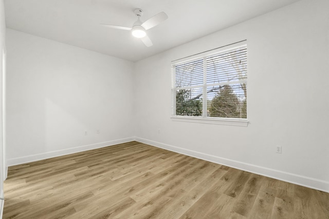 15284 331 Business Unit 11B, Freeport, FL 32439 - empty room with baseboards, light wood-type flooring, and a ceiling fan