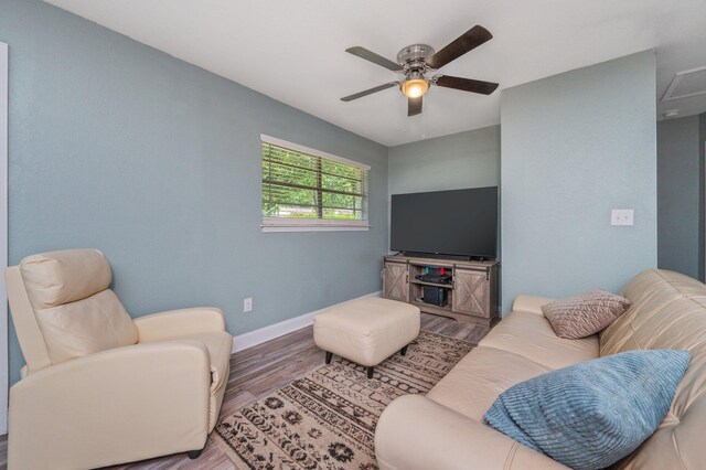 544 Purl Adams Ave, Crestview, FL 32539 - living area featuring wood finished floors, baseboards, and a ceiling fan