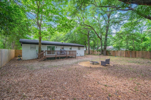 544 Purl Adams Ave, Crestview, FL 32539 - back of house featuring a deck, a fenced backyard, and brick siding