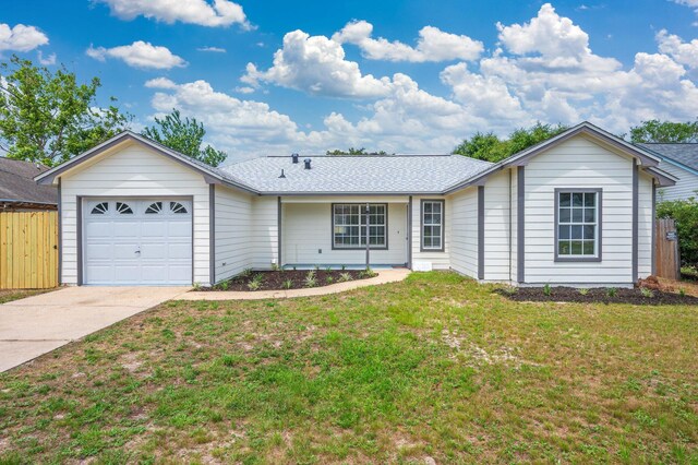 2129 Hillary Ln, Navarre, FL 32566 - ranch-style house with a garage, driveway, and a shingled roof