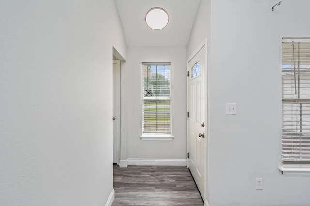 2129 Hillary Ln, Navarre, FL 32566 - doorway to outside featuring baseboards and wood finished floors