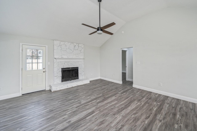 2129 Hillary Ln, Navarre, FL 32566 - unfurnished living room with ceiling fan, wood finished floors, a fireplace, baseboards, and high vaulted ceiling