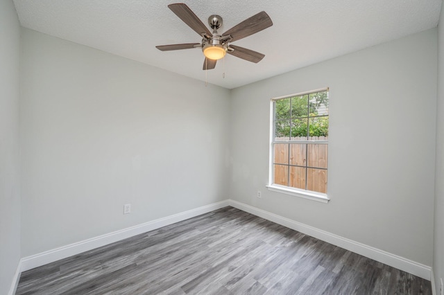 2129 Hillary Ln, Navarre, FL 32566 - spare room with wood finished floors, baseboards, and a ceiling fan