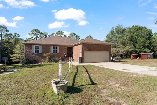 4555 Wolf Track Rdg Unit 6.44Ac, Crestview, FL 32539 - ranch-style home with driveway, a garage, brick siding, and a front lawn