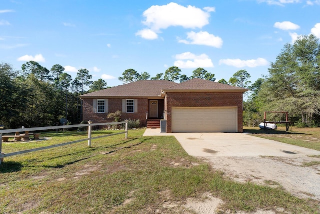 4555 Wolf Track Rdg Unit 6.44Ac, Crestview, FL 32539 - single story home with concrete driveway, brick siding, a garage, and a front yard