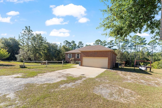 4555 Wolf Track Rdg Unit 6.44Ac, Crestview, FL 32539 - view of home's exterior featuring a yard, concrete driveway, a garage, brick siding, and cooling unit