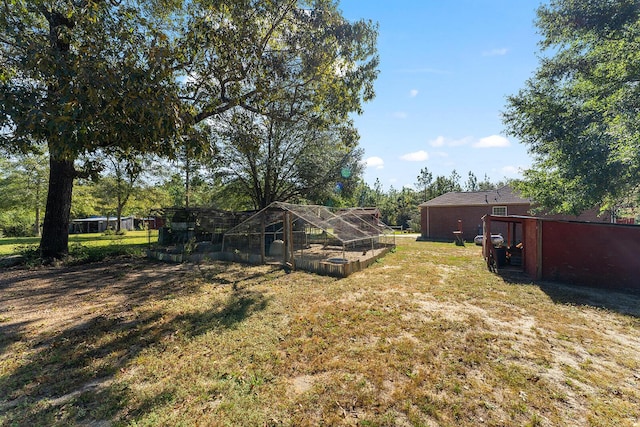 4555 Wolf Track Rdg Unit 6.44Ac, Crestview, FL 32539 - view of grassy yard featuring an outbuilding and exterior structure