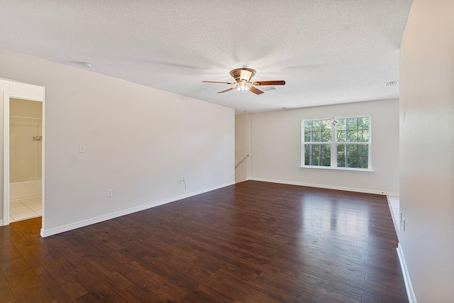 4555 Wolf Track Rdg Unit 6.44Ac, Crestview, FL 32539 - spare room with a ceiling fan, dark wood-type flooring, a textured ceiling, and baseboards