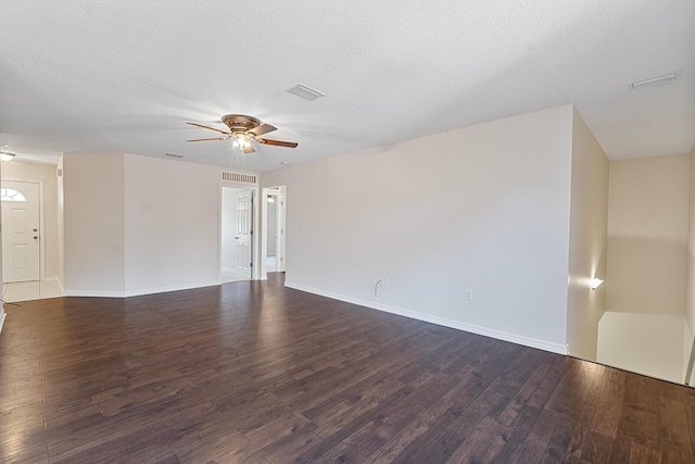 4555 Wolf Track Rdg Unit 6.44Ac, Crestview, FL 32539 - unfurnished room featuring ceiling fan, dark wood-style flooring, baseboards, and a textured ceiling