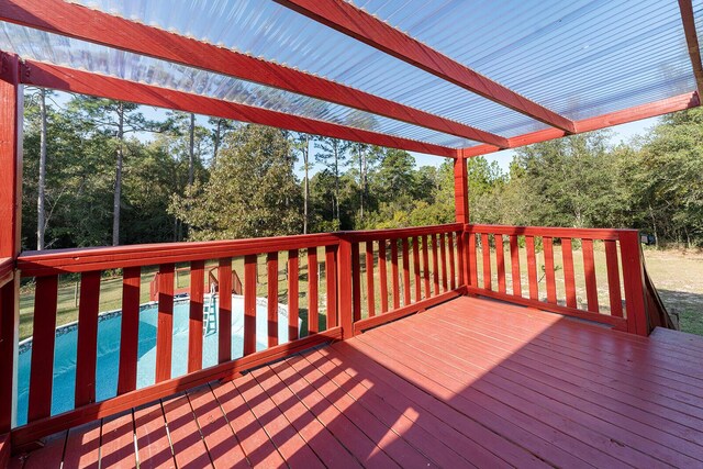 4555 Wolf Track Rdg Unit 6.44Ac, Crestview, FL 32539 - wooden deck featuring an outdoor pool and view of scattered trees