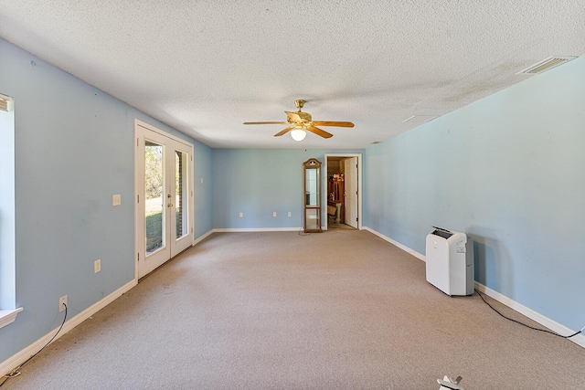 4555 Wolf Track Rdg Unit 6.44Ac, Crestview, FL 32539 - unfurnished room with french doors, carpet floors, a textured ceiling, ceiling fan, and baseboards