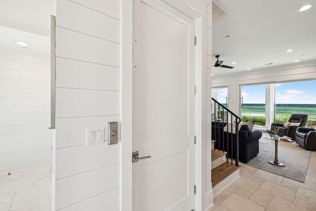 323 Pompano St, Inlet Beach, FL 32461 - corridor with a water view, stone tile floors, stairs, recessed lighting, and ornamental molding
