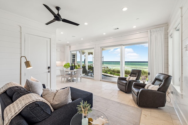 323 Pompano St, Inlet Beach, FL 32461 - living area featuring recessed lighting, a water view, stone tile flooring, ornamental molding, and ceiling fan