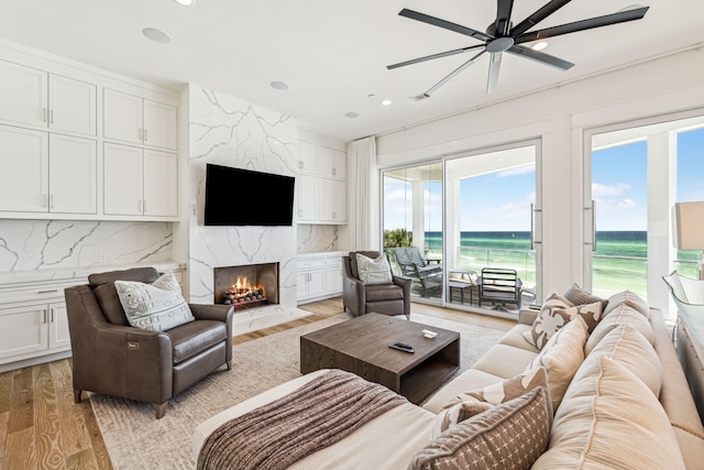 323 Pompano St, Inlet Beach, FL 32461 - living area with light wood-style floors, recessed lighting, a ceiling fan, and a fireplace
