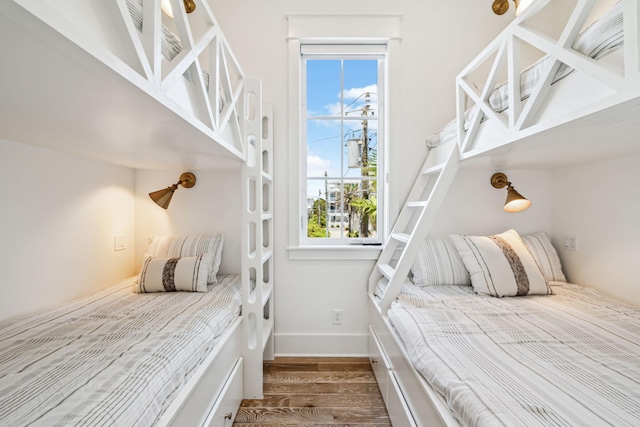 323 Pompano St, Inlet Beach, FL 32461 - bedroom with wood finished floors, multiple windows, and baseboards