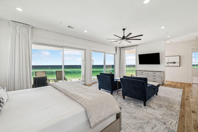 323 Pompano St, Inlet Beach, FL 32461 - bedroom with light wood-style flooring, recessed lighting, multiple windows, access to exterior, and baseboards