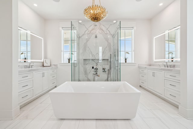 323 Pompano St, Inlet Beach, FL 32461 - bathroom with a chandelier, a marble finish shower, a freestanding bath, two vanities, and recessed lighting