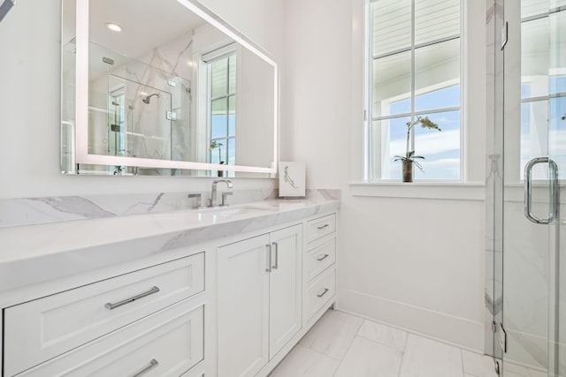 323 Pompano St, Inlet Beach, FL 32461 - bathroom with vanity, a marble finish shower, healthy amount of natural light, and marble look tiles