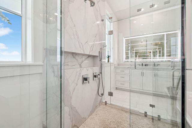 323 Pompano St, Inlet Beach, FL 32461 - bathroom featuring a marble finish shower, vanity, and tile walls