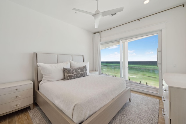 323 Pompano St, Inlet Beach, FL 32461 - bedroom with access to exterior, wood finished floors, a water view, a ceiling fan, and recessed lighting