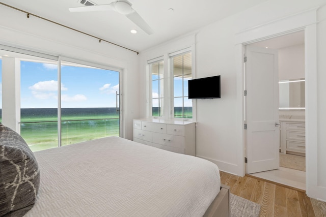 323 Pompano St, Inlet Beach, FL 32461 - bedroom featuring light wood-type flooring, access to outside, a water view, baseboards, and a ceiling fan