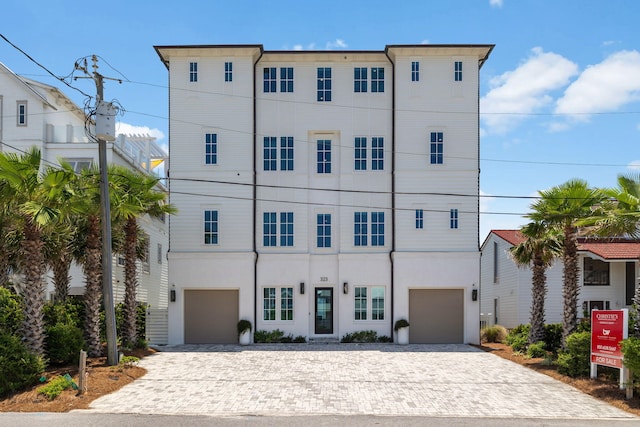 323 Pompano St, Inlet Beach, FL 32461 - view of property featuring decorative driveway and a garage
