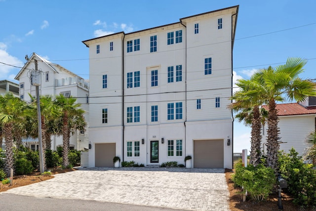 323 Pompano St, Inlet Beach, FL 32461 - view of front of house with decorative driveway and stucco siding