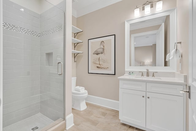 134 Norwood Dr Unit Ph1, Miramar Beach, FL 32550 - bathroom with a stall shower, toilet, vanity, baseboards, and crown molding