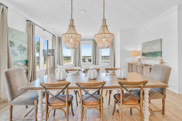134 Norwood Dr Unit Ph1, Miramar Beach, FL 32550 - dining space with a chandelier, light wood-style floors, and ornamental molding
