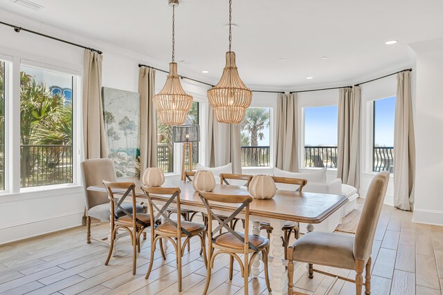134 Norwood Dr Unit Ph1, Miramar Beach, FL 32550 - dining area with light wood-style flooring, a chandelier, baseboards, and recessed lighting