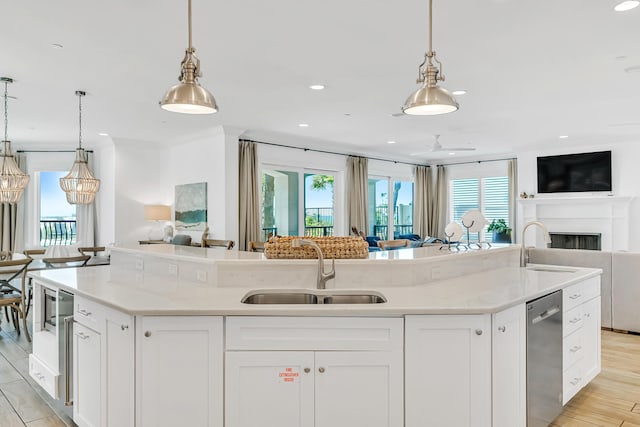 134 Norwood Dr Unit Ph1, Miramar Beach, FL 32550 - kitchen with open floor plan, a sink, a kitchen island with sink, dishwasher, and recessed lighting